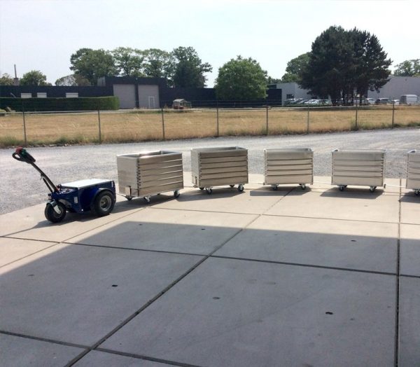 Jobmaster HD Electric Pedestrian Tug towing metal containers