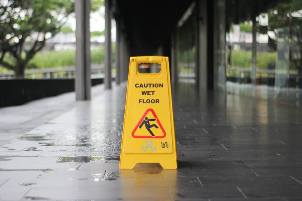 Wet Floor Sign On Walkway