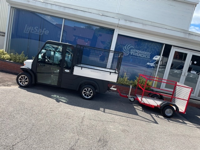 Customer Testimonials 3 Electric flatbed truck with cage towing a trailer