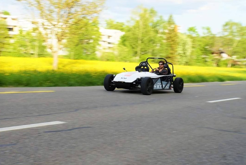 eRod Electric Powered Sports Car 5 E-ROD all electric sports car driving along a road